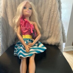 3 ft tall Barbie with movable arms and waist and Justice purse
